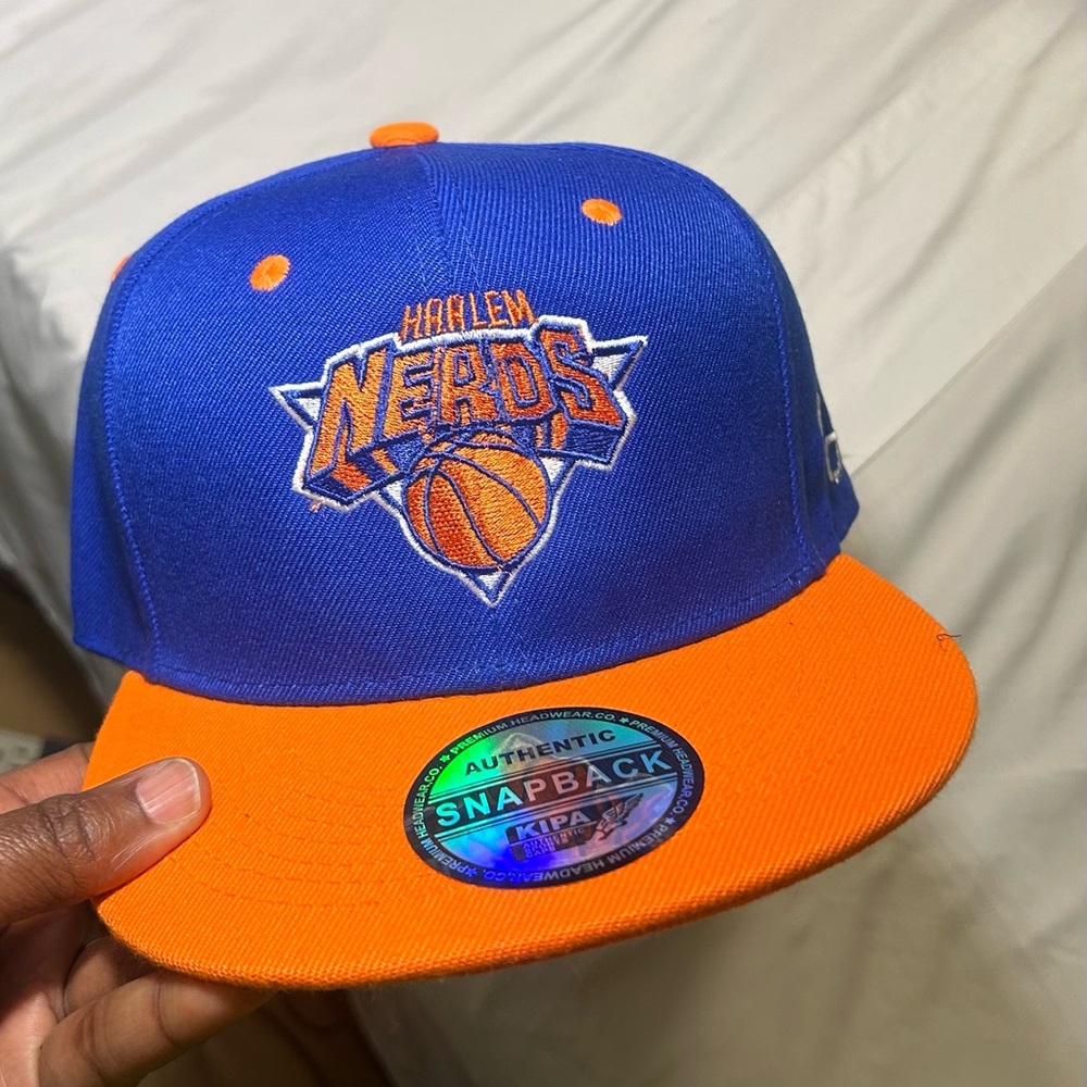 NY KNICKS COLORS & FRONT, WITH THE HARLEM NERDS LOGO. SWEATER & PANTS AVAILABLE